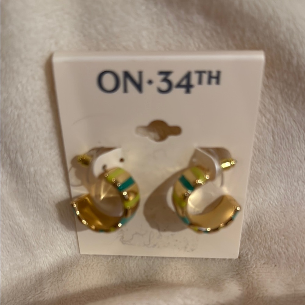 Gold and Green Earrings with Swirled Design. NWT